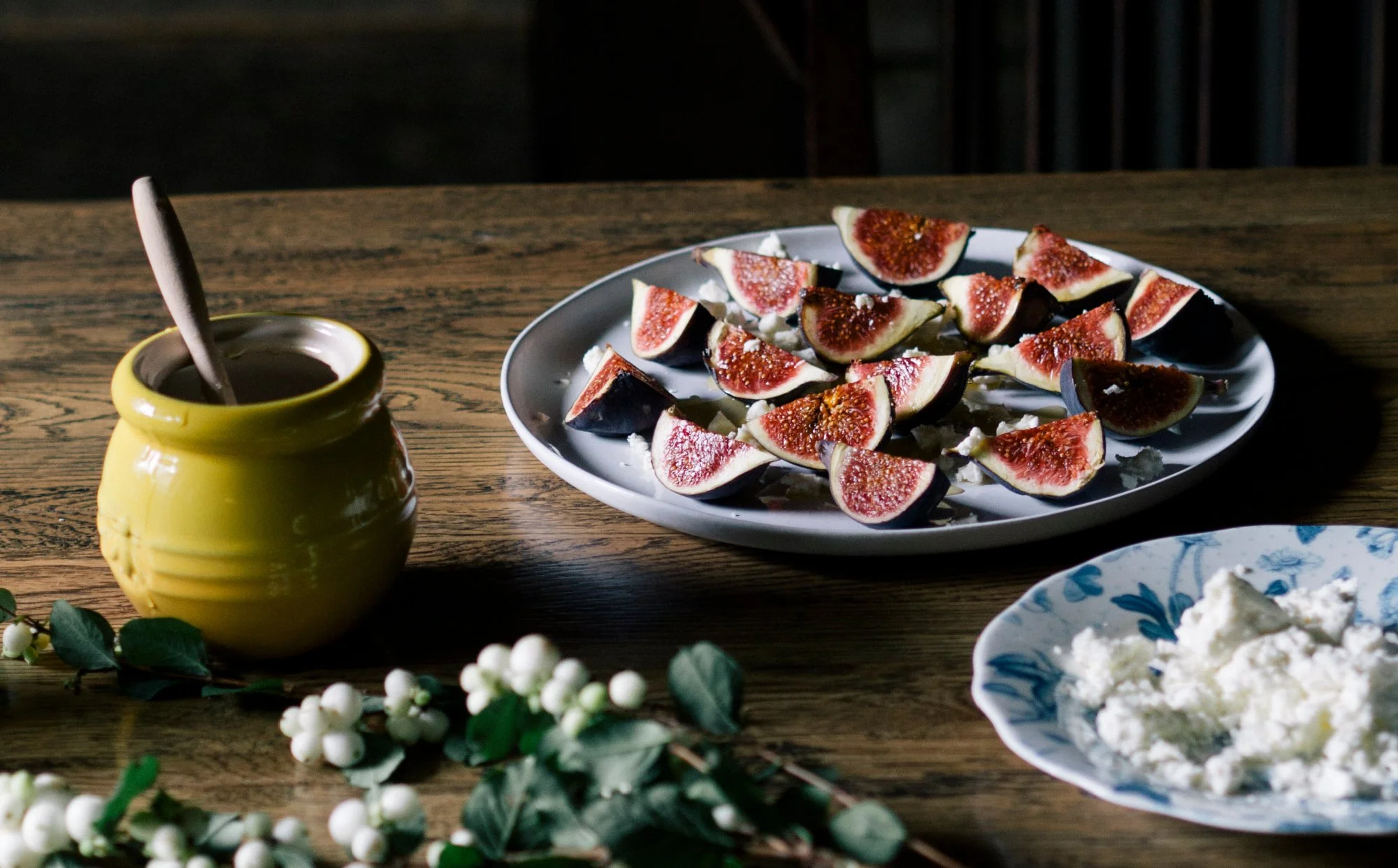 figs with crumbled feta and honey in a jar