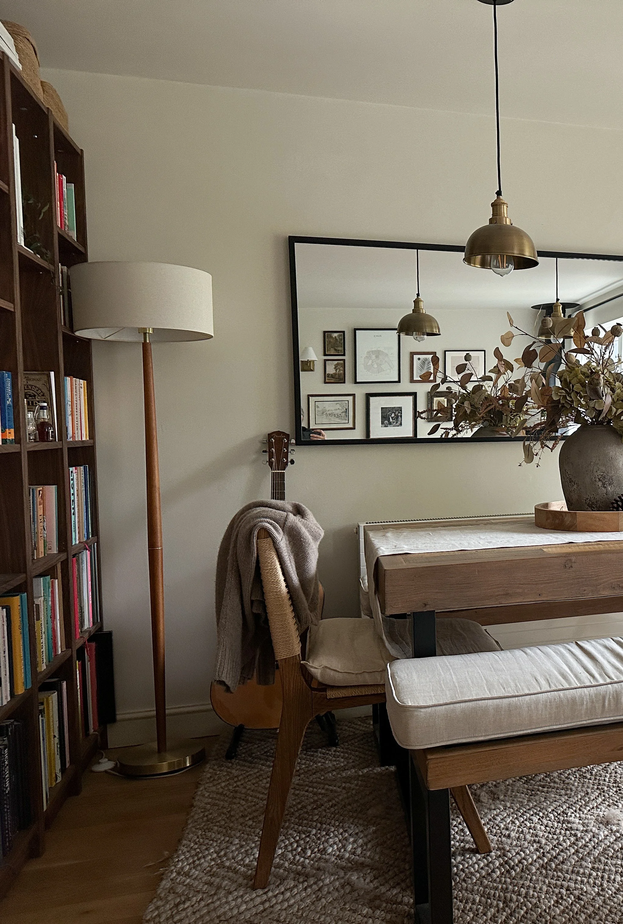 dark wood bookcase and dining table with benches
