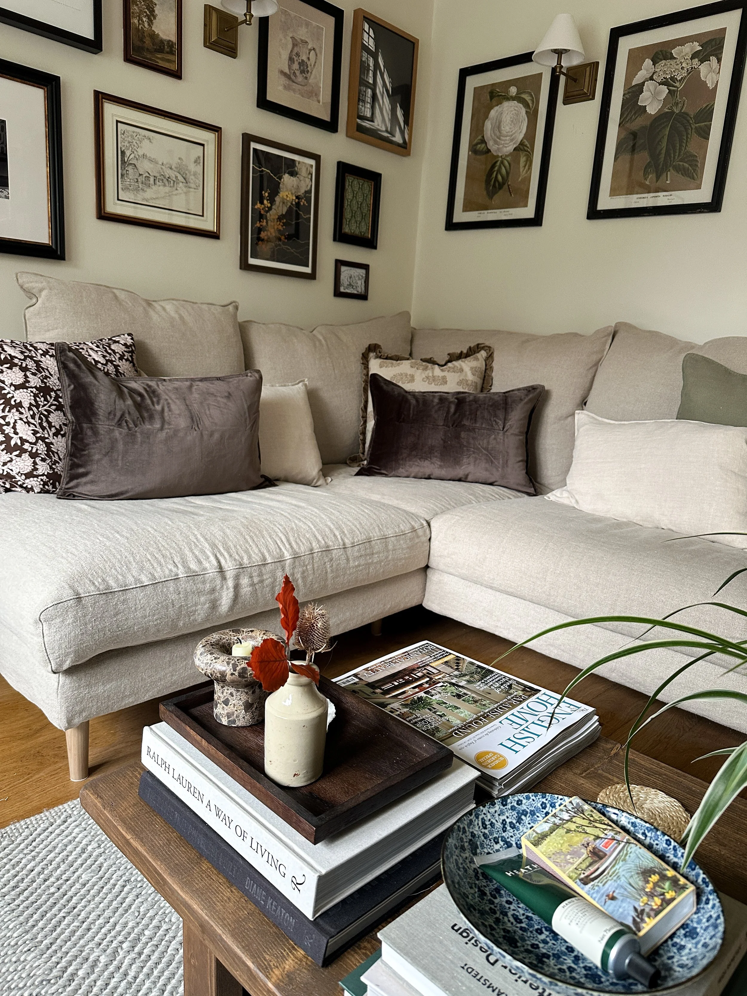 beige linen sofa with dark wood coffee table in foreground
