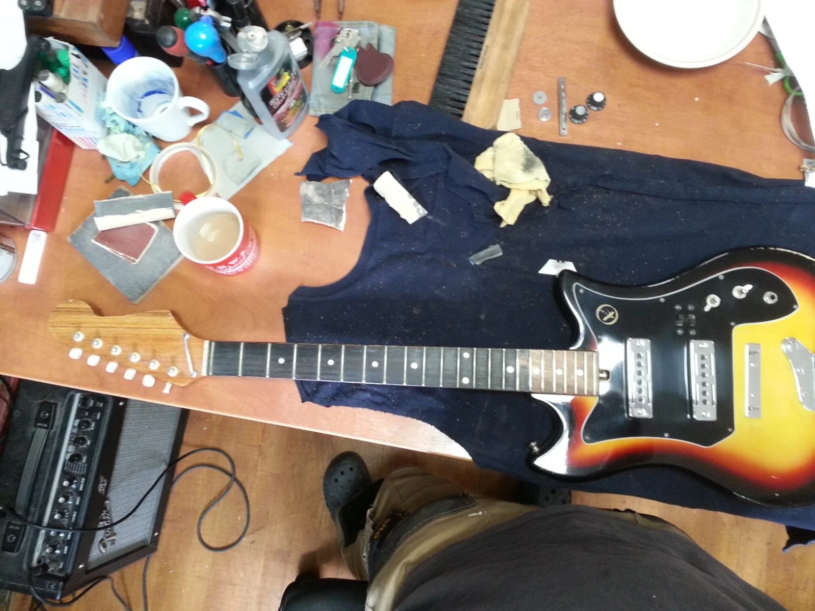 1968 Kay ET200 having its fret board cleaned