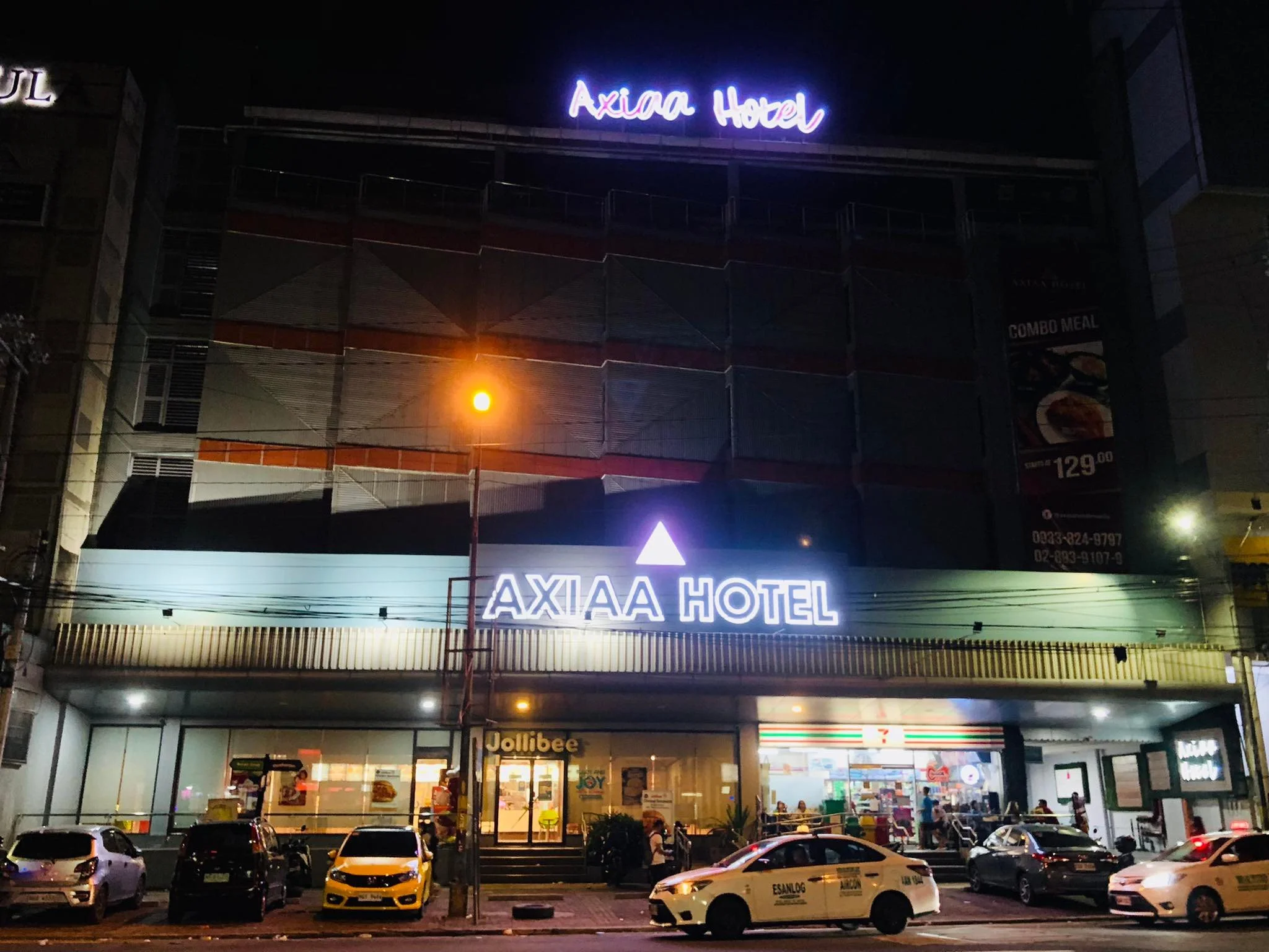 Axiaa Hotel exterior at night in Quezon City near SM North EDSA