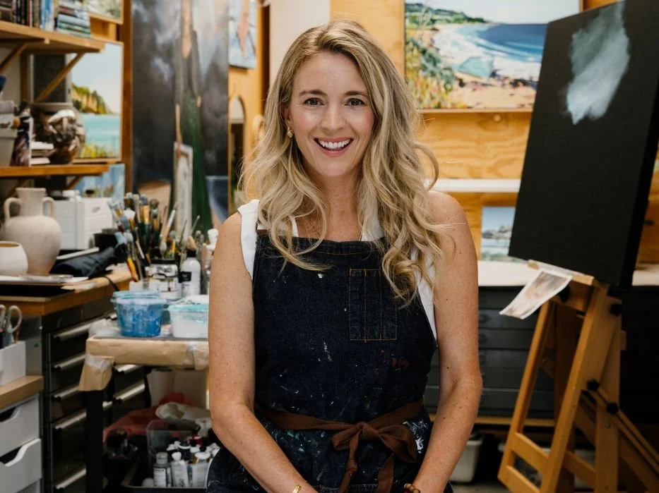 Jaqueline Burgess wearing a blue overall in her studio.