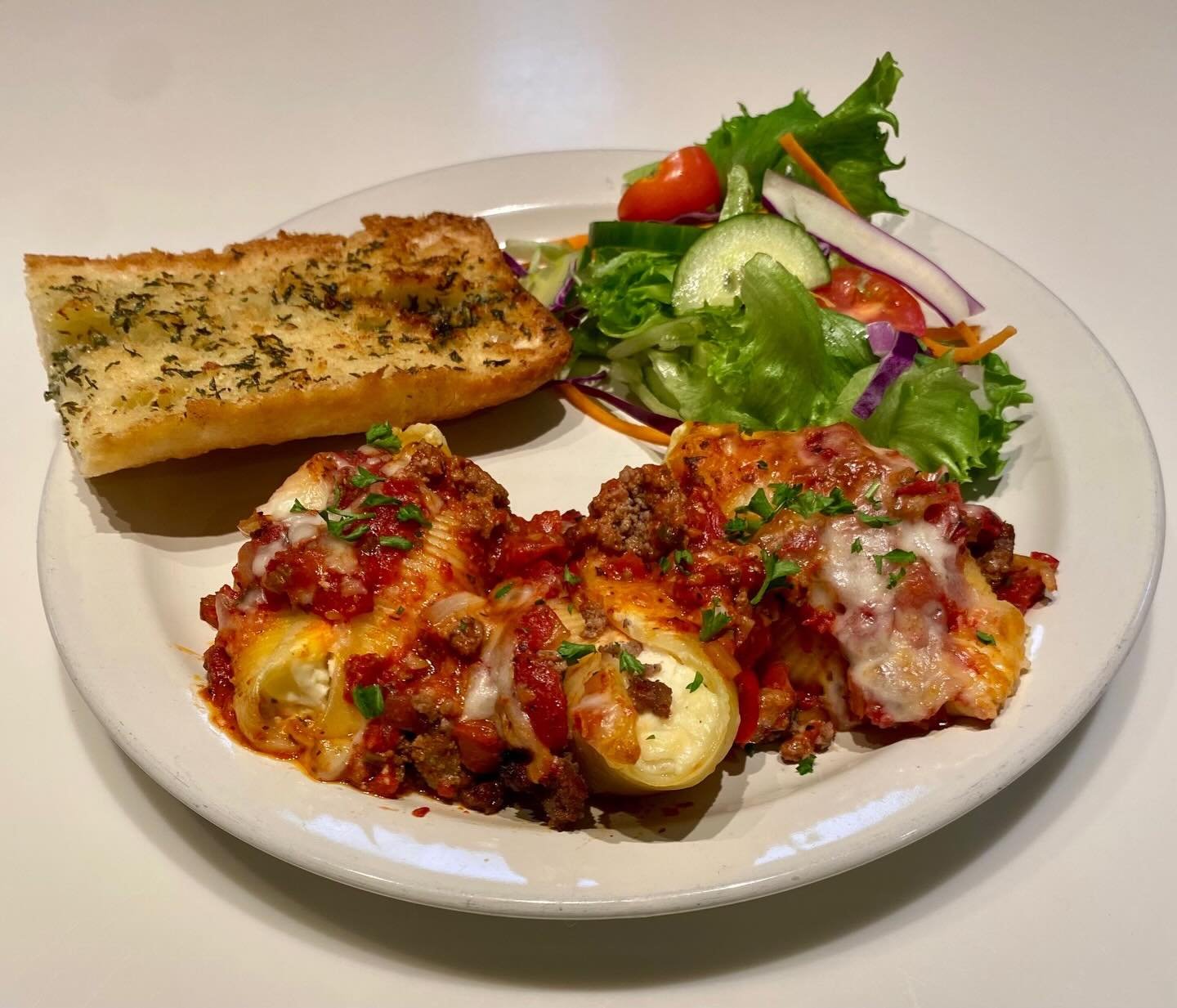 Wednesday Night Special!
Stuffed Shells (Beef or Vegetarian)
Served with Dinner Roll &amp; Side Salad ($15)
Pasta Shells stuffed with Ricotta, Cottage Cheese, Mozzarella and Herbs. Tomato Sauce with Onions, Bell Peppers, Celery, Garlic, Basil, Oregan