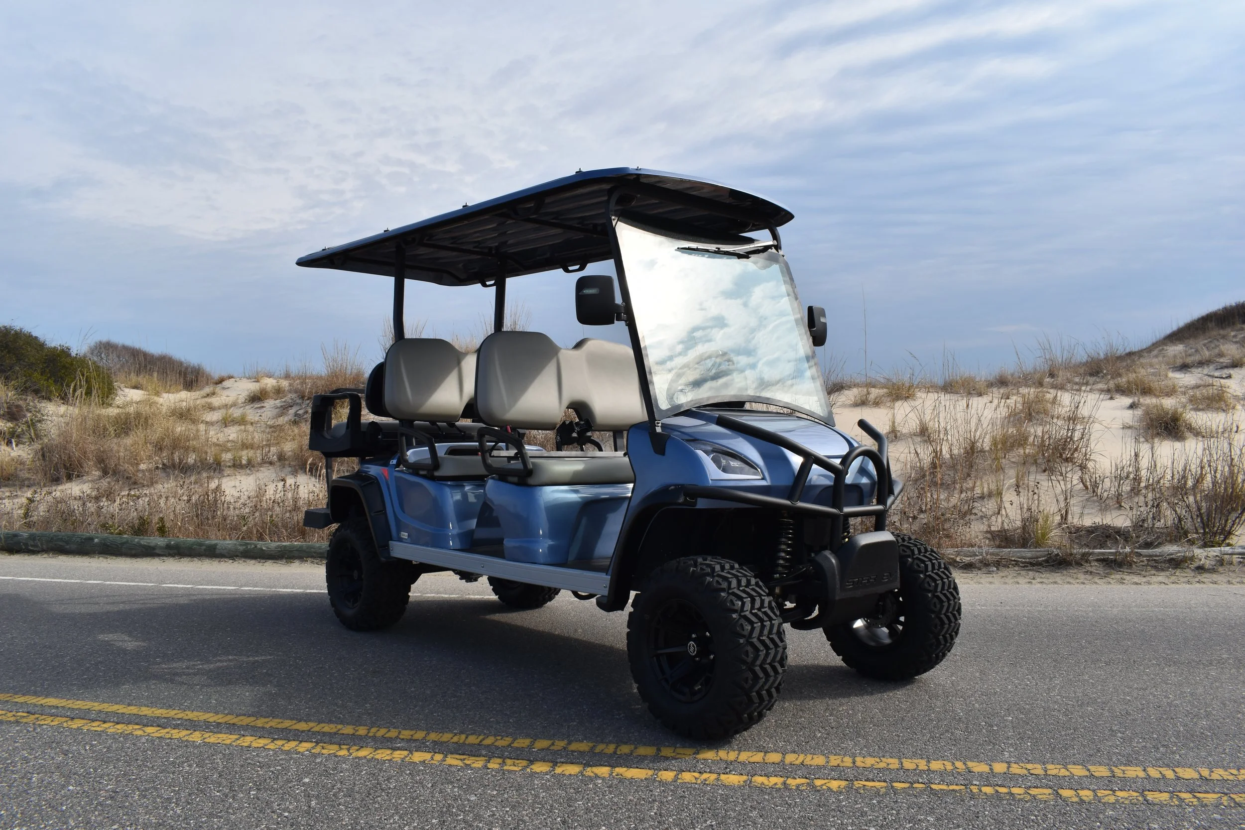 Luxe Kart golf cart LSV (low-speed vehicle) which seats six people. Street legal with many features.