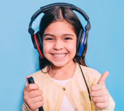 Smiling girl wearing headphones and giving thumbs up