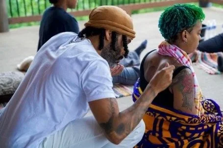 A sacred medicine ceremony gathering outdoors group of people practicing yoga outdoors