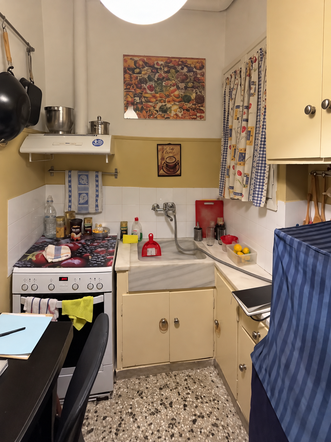 Cluttered Retro Kitchen Before Remodel.png