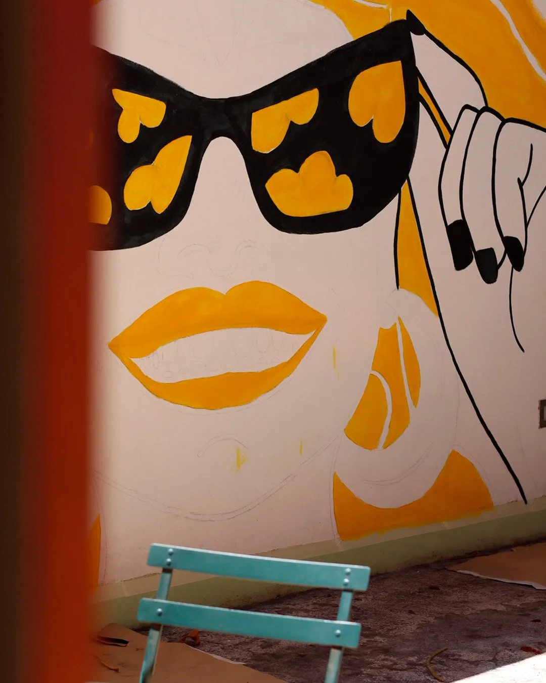 Close-up of early-stage mural details at Peloton Café