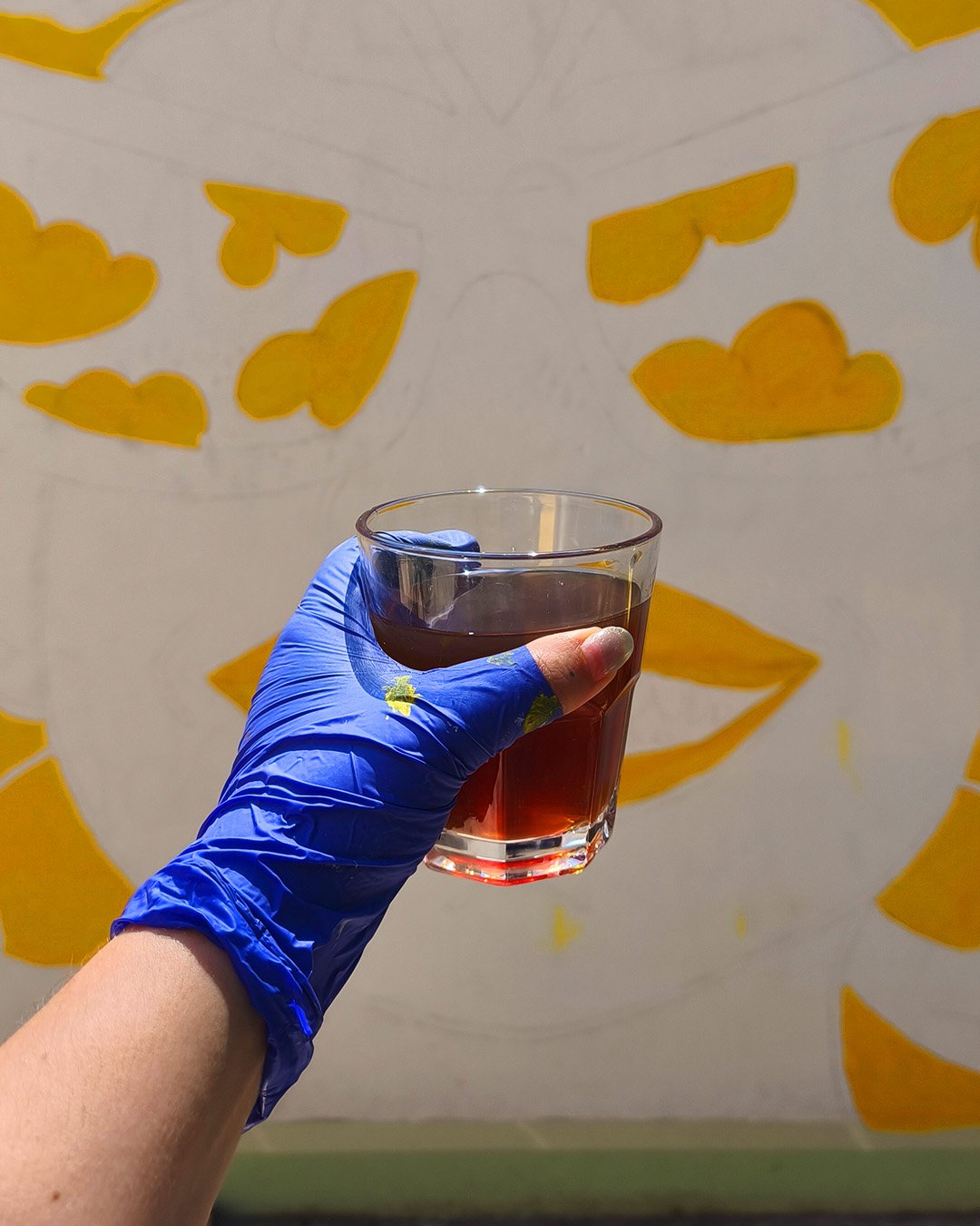 Cold brew coffee, Peloton Café's summer specialty, with the mural in the background