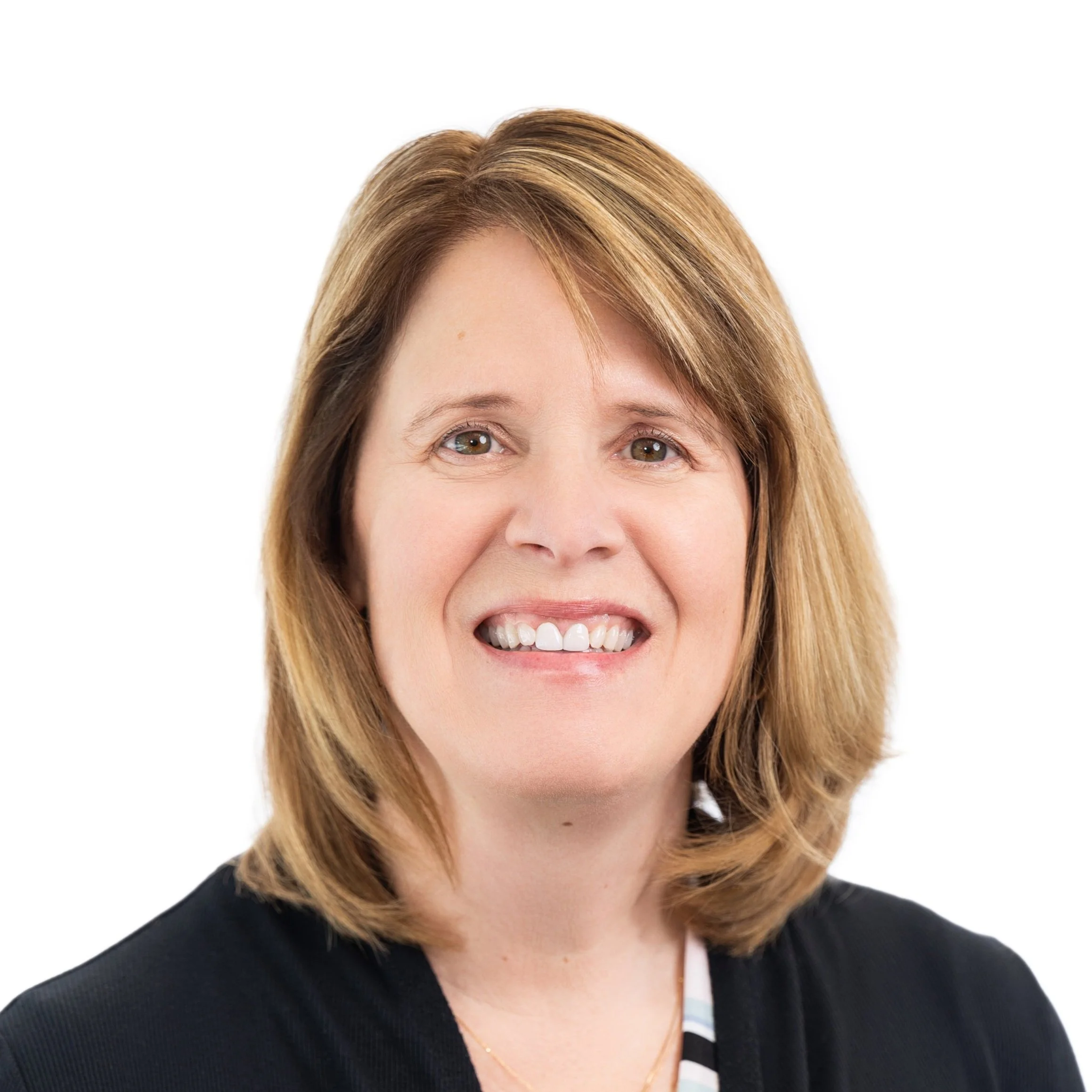 Headshot of smiling woman with shoulder-length light brown hair, wearing a black blazer, against a white background.