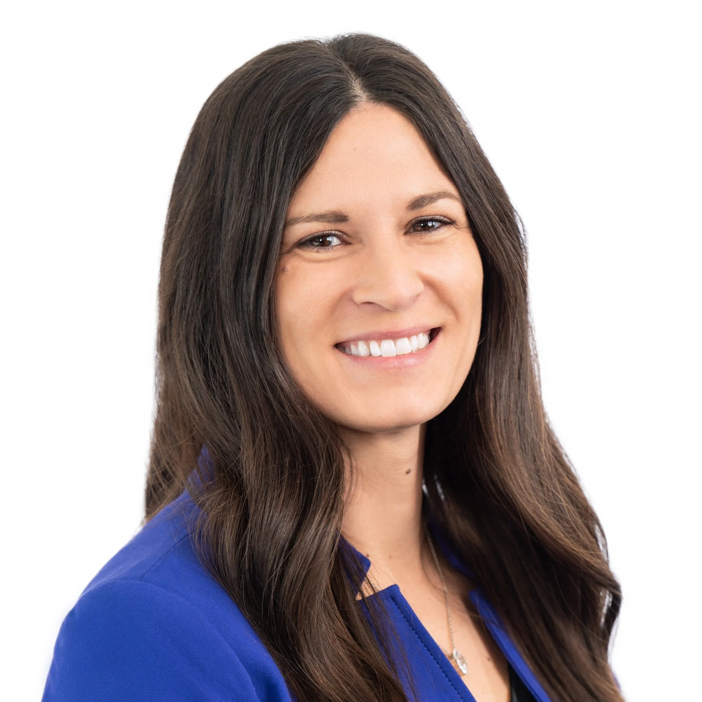 Professional woman with long brown hair and a blue blazer smiling at the camera