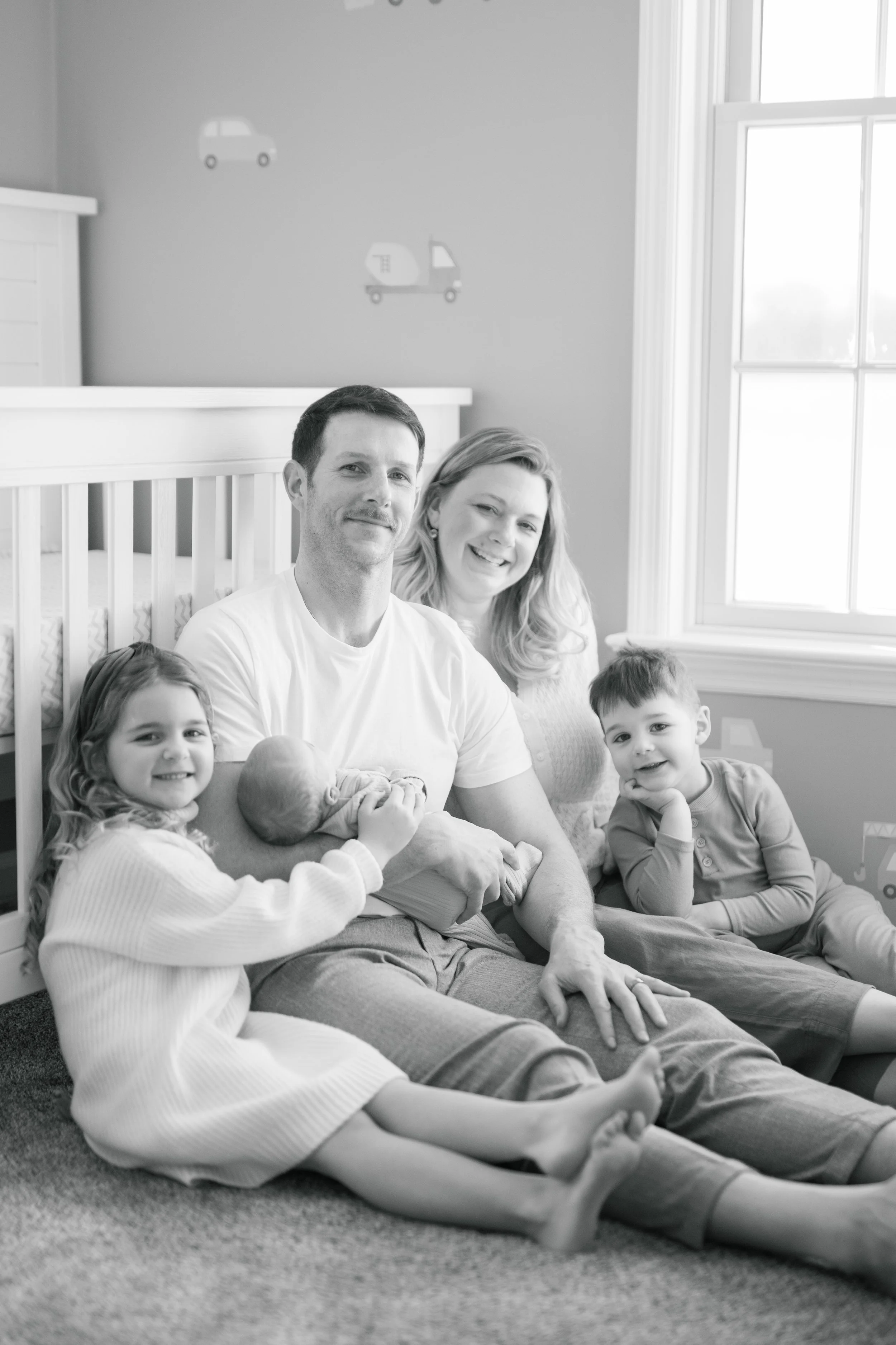central Pennsylvania family snuggled in nursery with new baby brother