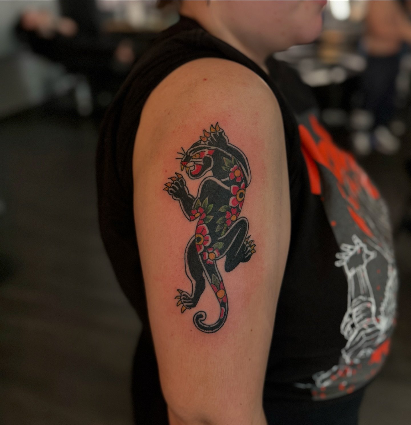 New Work Alert by @thomasplunktattooer!
Check out this bold and colorful panther piece 🐆 &ndash; a perfect mix of traditional style and vibrant floral patterns.

Stop by Evermore today between 12-9 PM for your next tattoo or piercing. Walk-ins welco
