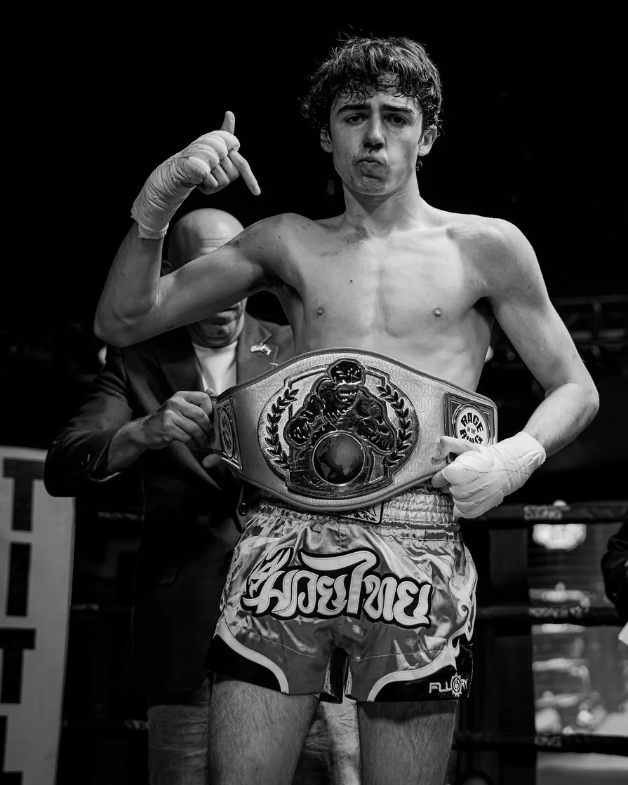 Amateur MMA fighter from Fortify Fight Club holding a championship belt after a victory in the West Valley