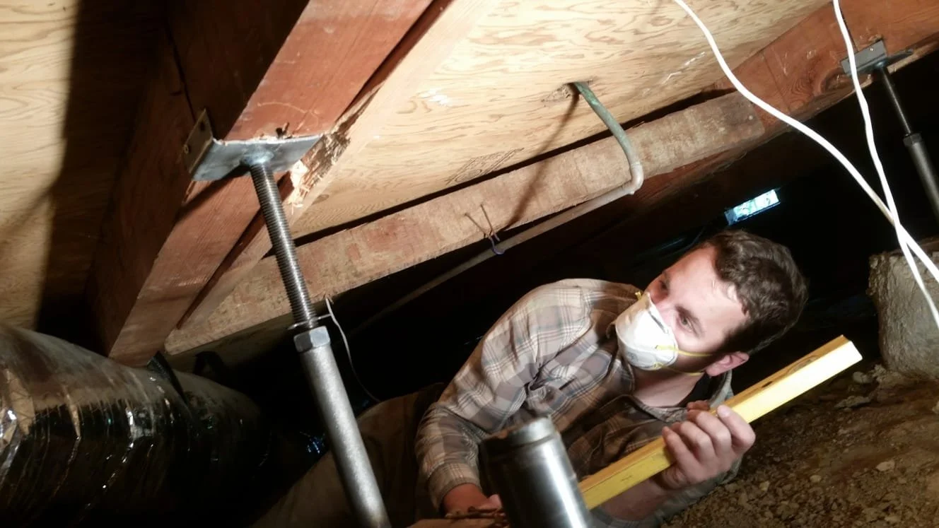 RELEVELING A HOUSE AND REINFORCING THE FOUNDATION