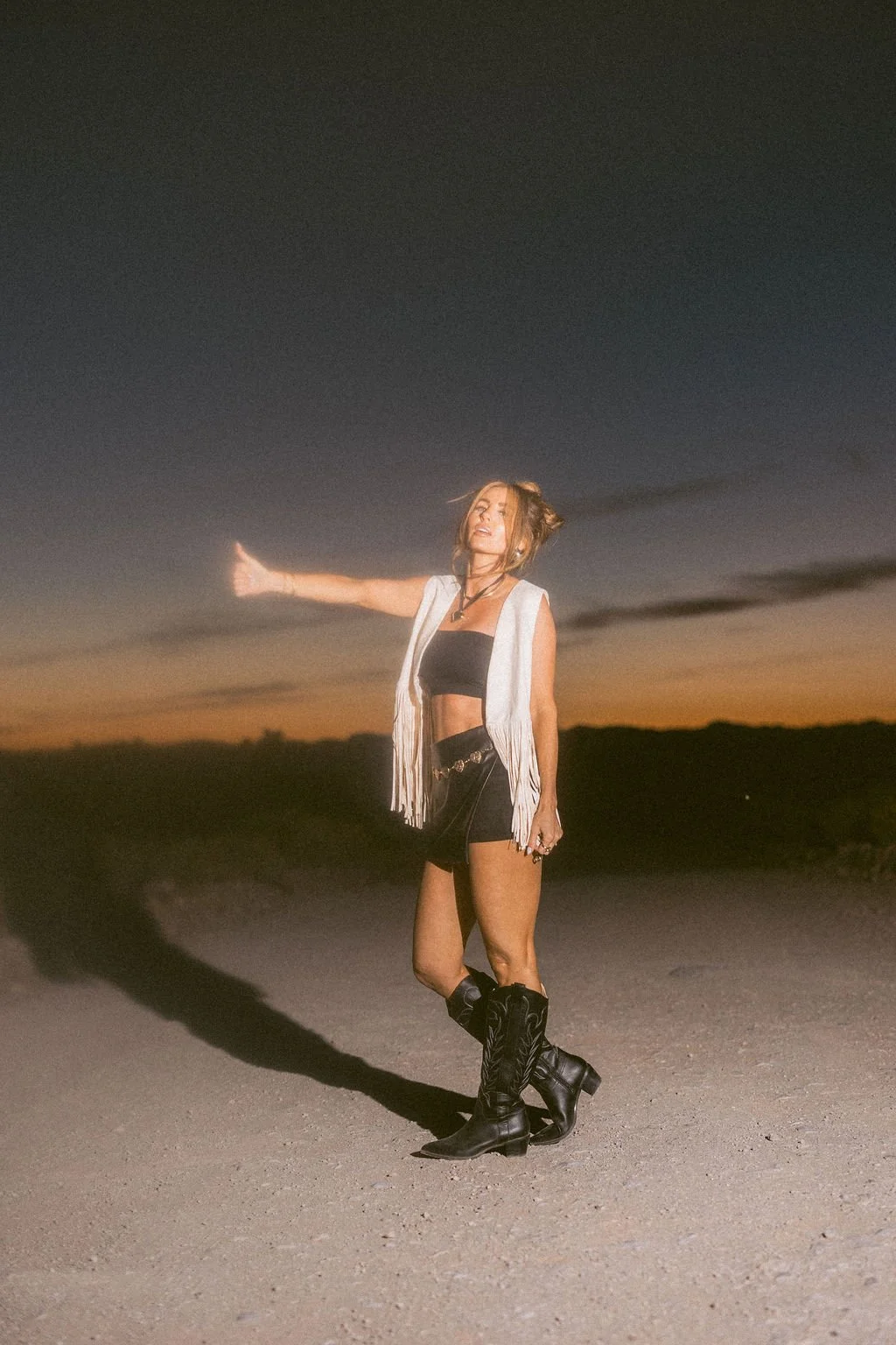 High fashion boutique photography featuring bold styling and dramatic editorial imagery at sunset. This fashion photoshoot creates striking visual content for clothing brands, boutiques, designers, advertising campaigns, websites, and social media.