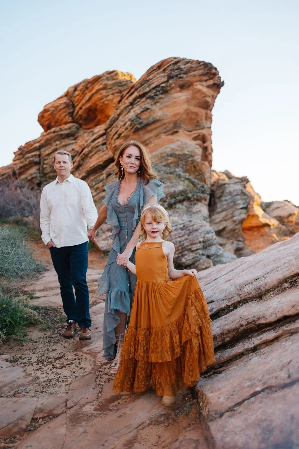 Lifestyle family photography capturing a mother and her children against the beautiful red rock landscapes of Southern Utah. This St. George family photoshoot creates natural, timeless images filled with genuine connection, personality, and the speci