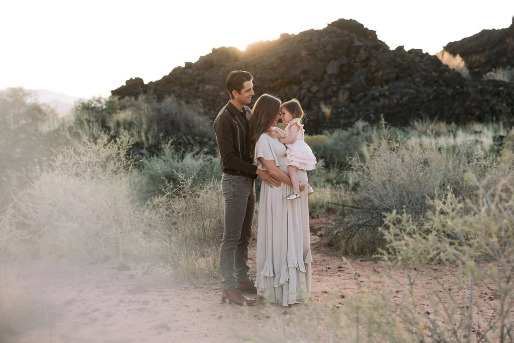 Lifestyle maternity photography capturing an expecting family surrounded by the natural beauty of Southern Utah. This St. George maternity photoshoot celebrates growing families with authentic connection, natural emotion, and timeless images of this 