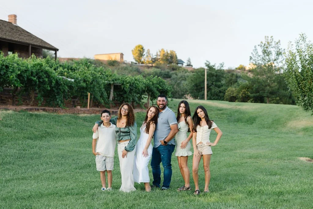 Lifestyle family photography capturing a mother and her children together in a beautiful outdoor setting. This St. George family photoshoot celebrates genuine connection and creates timeless, natural images that capture each child’s personality and t