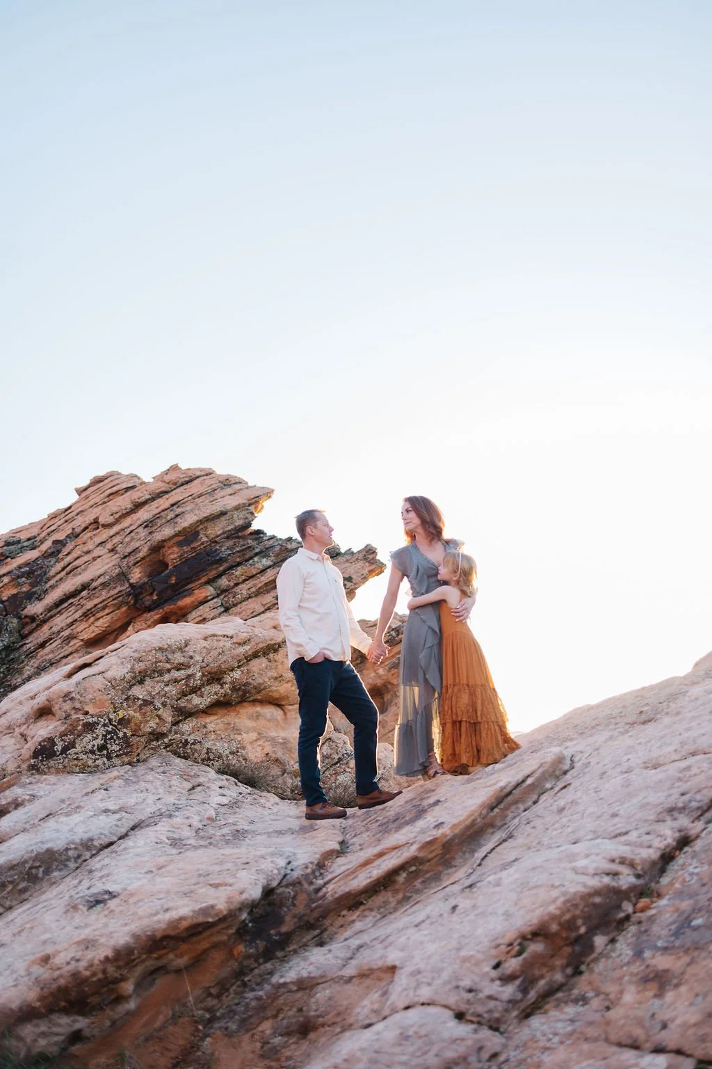 Lifestyle family photography featuring authentic connection and playful moments in the red rock landscapes of Southern Utah. This St. George family photoshoot captures natural interactions and meaningful memories for families looking for beautiful, t