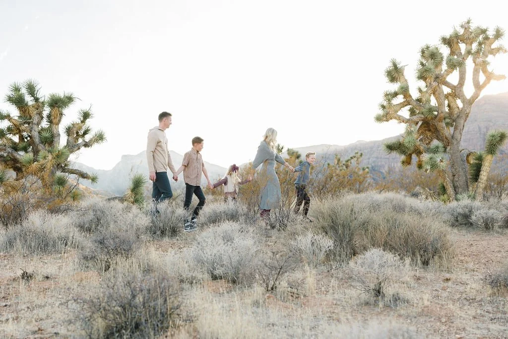 Adventure family photography capturing a family exploring together among the Joshua trees and desert landscapes of Southern Utah. This unique St. George family photoshoot combines natural movement, genuine connection, and beautiful desert scenery to 