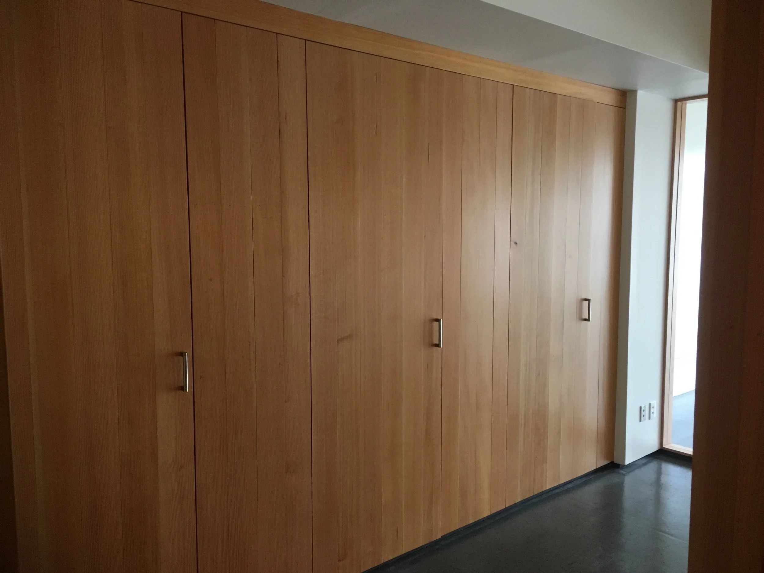 Conference Room accent wall concealed with douglas fir doors