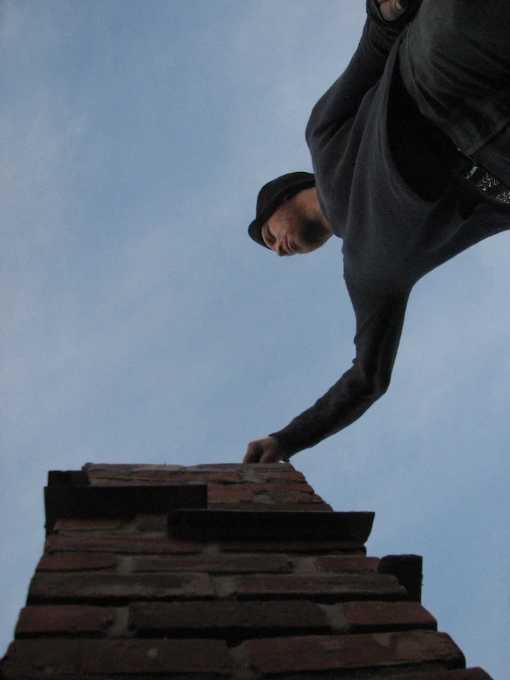 Installing drip stones as chimney is being rebuilt