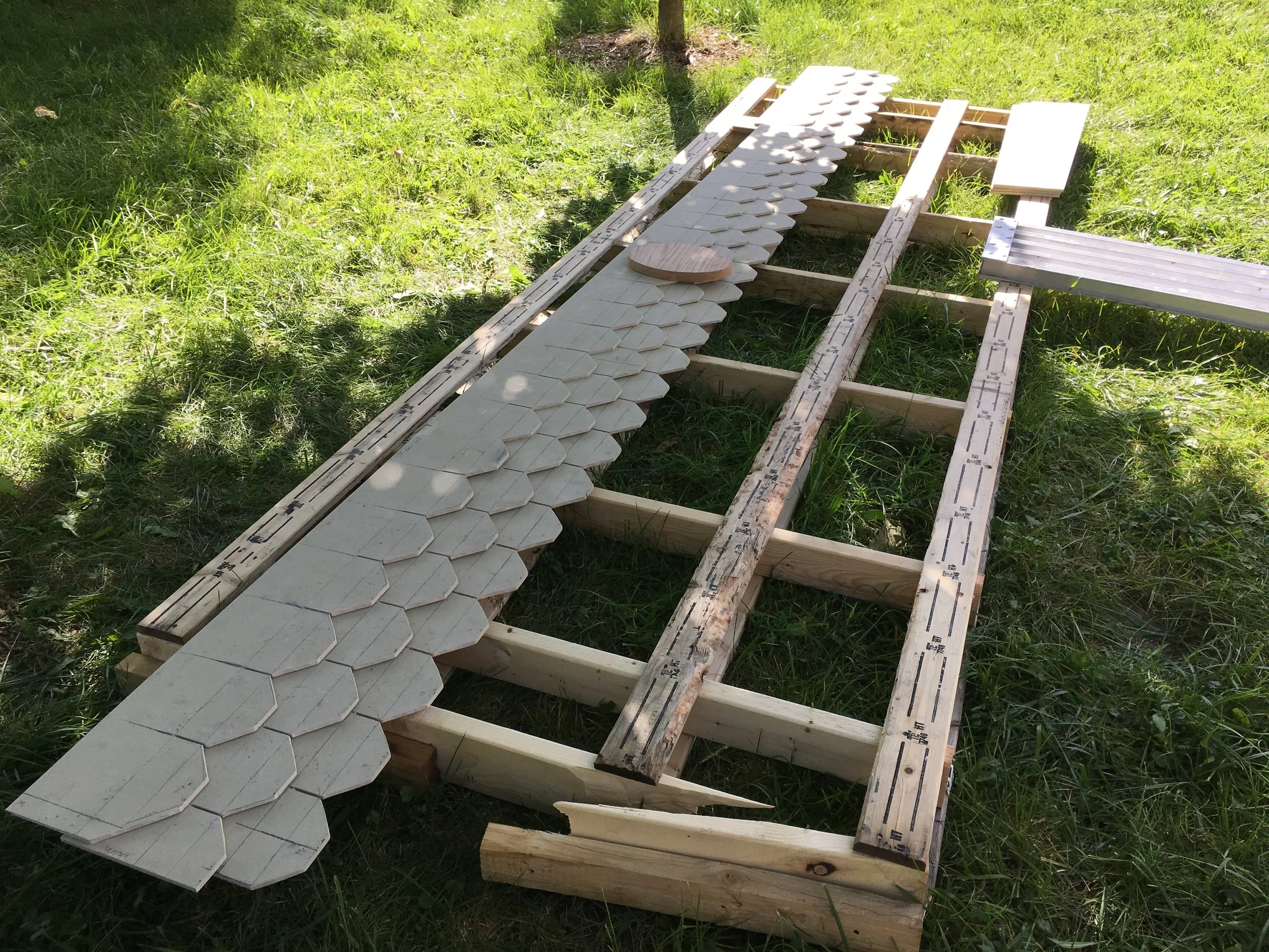 Laying out dog ear shingle detail.  Shingles hand cut in hardi board planks