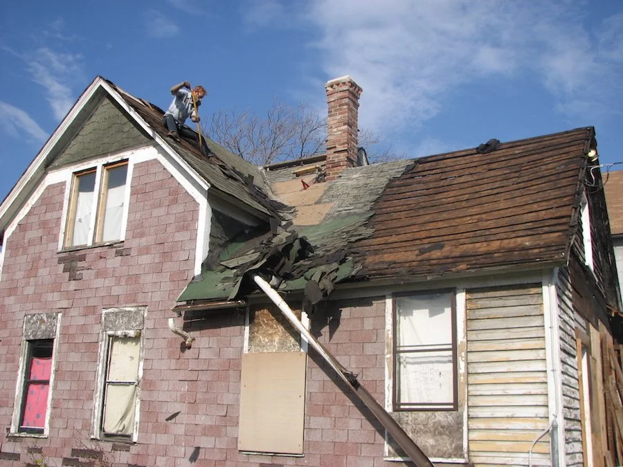 Tearing off a burned leaky roof solo