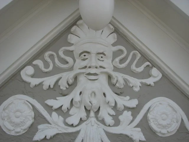 Decorative painting of ornamental detail at roof gable