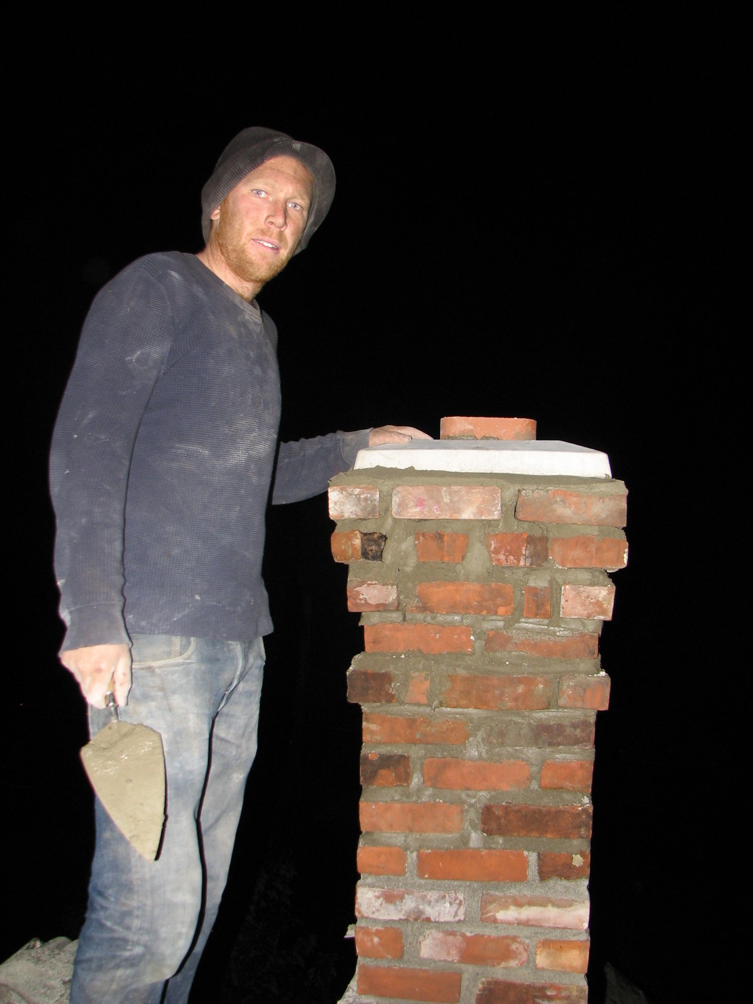 Working into the night to complete the chimney rebuild