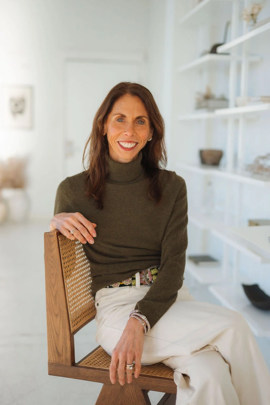 Headshot of smiling female tutor with short blonde hair wearing a lanyard.