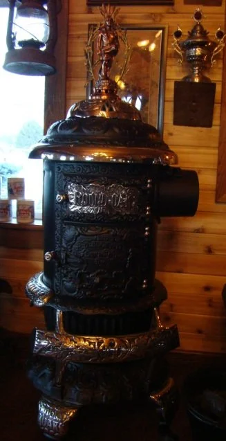 D-14 East coast Round Oak stove. Original three feathered Indian finial with a reproduction peace-pipe.
$2450.00