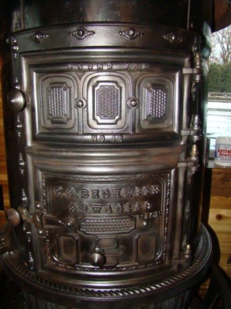 18'' Matchstrike with three matchstrike windows with the option of three mica windows. Cast Iron top ring. All original condition. The finial is an all original red two jeweled finial. $3250.00