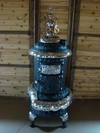 M- 16 Round Oak Stove. This stove is restored and has a new jacket / barrel ready to burn! $2250.00