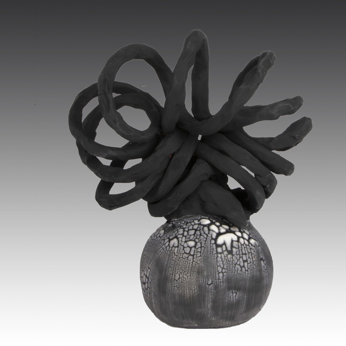 Wild Ones #18 This is a black twirl with crawl glaze on the base. I will be making up more crawl glaze for new pieces in the future.