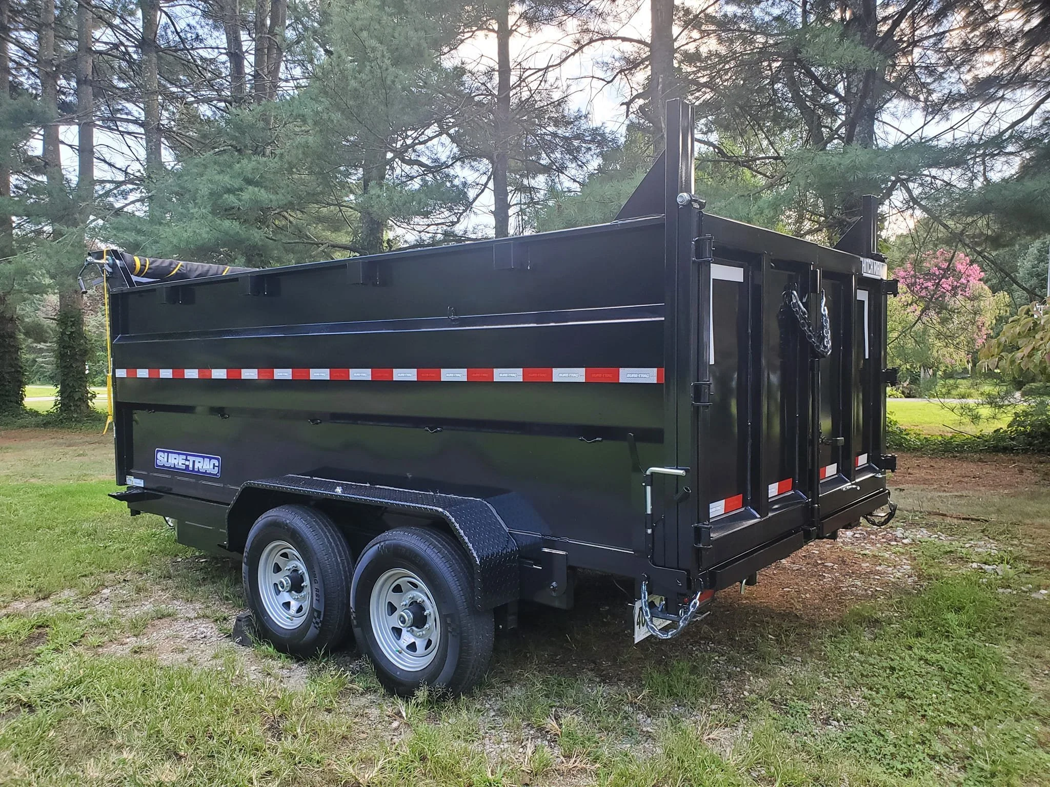 back angle of black dumpster trailer