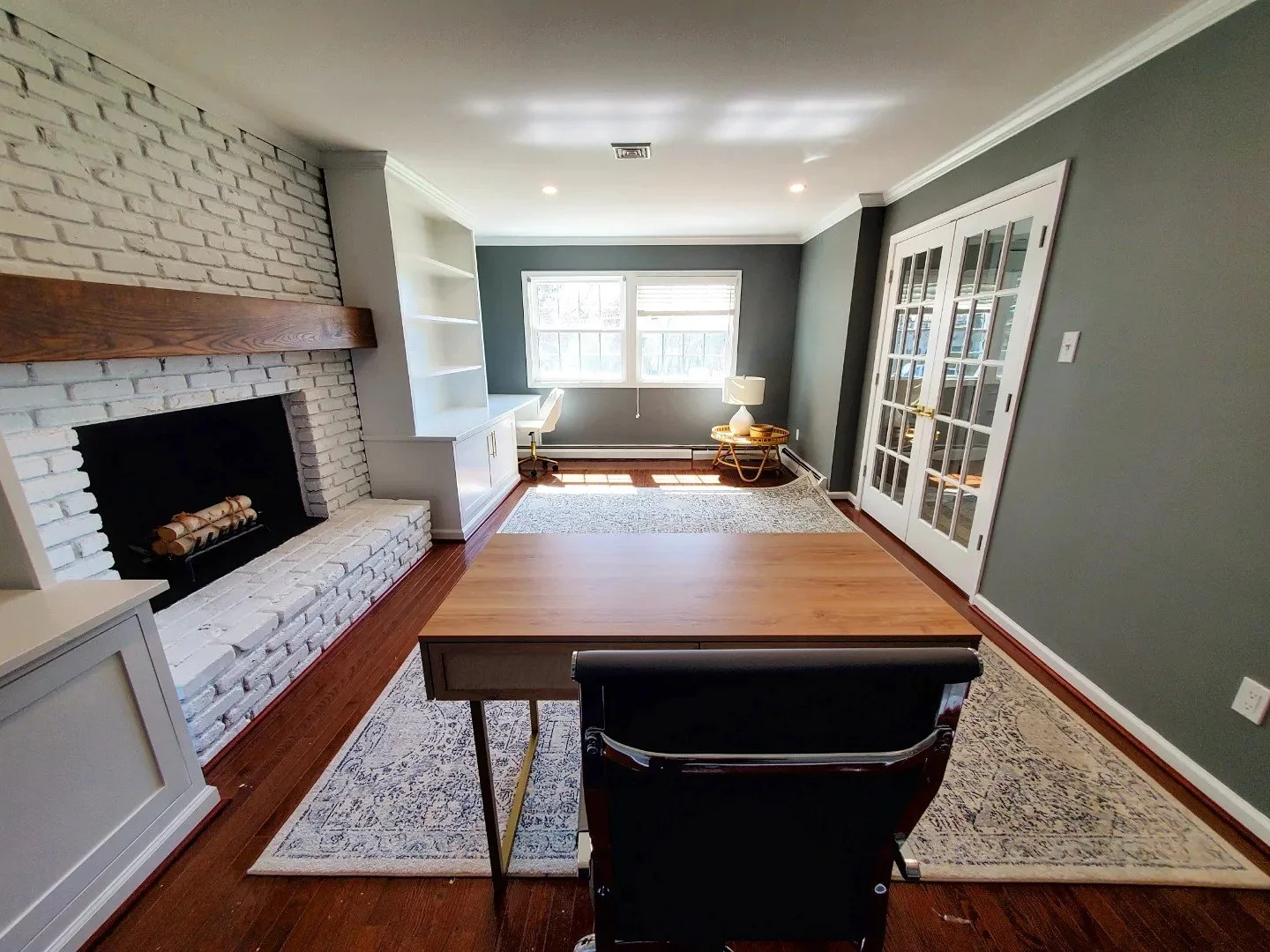 office with custom built-in shelves and desk