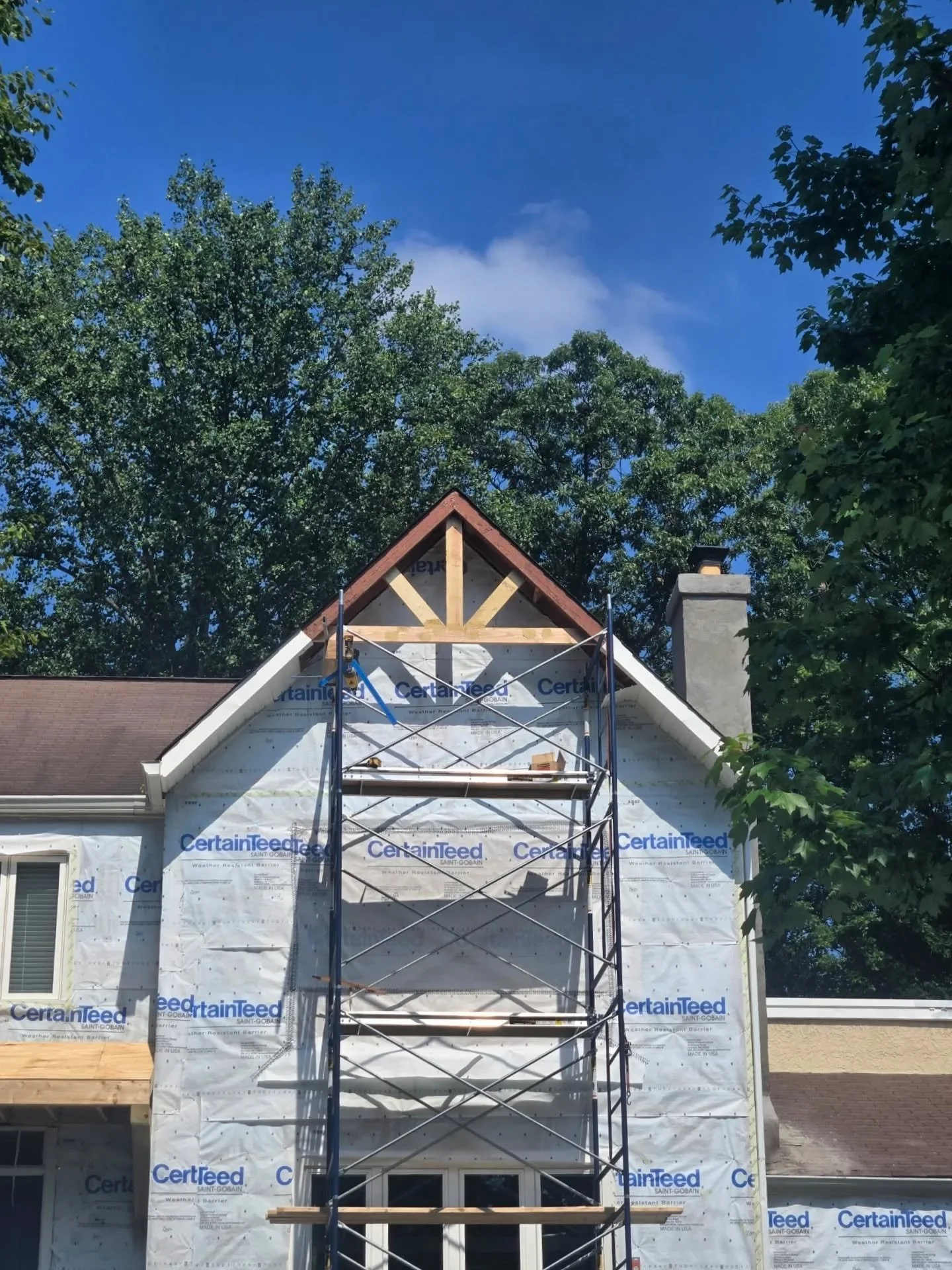 custom carpentry on house roof peak