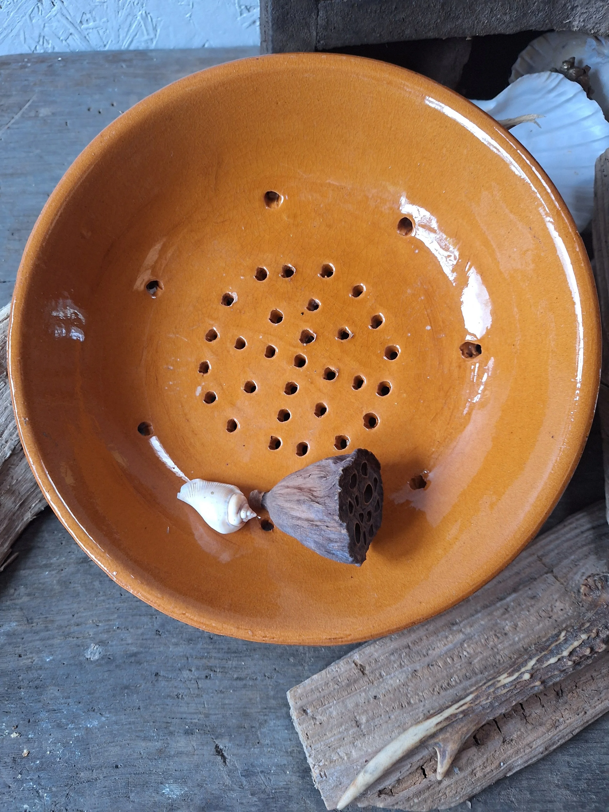 French orange glazed draining dish