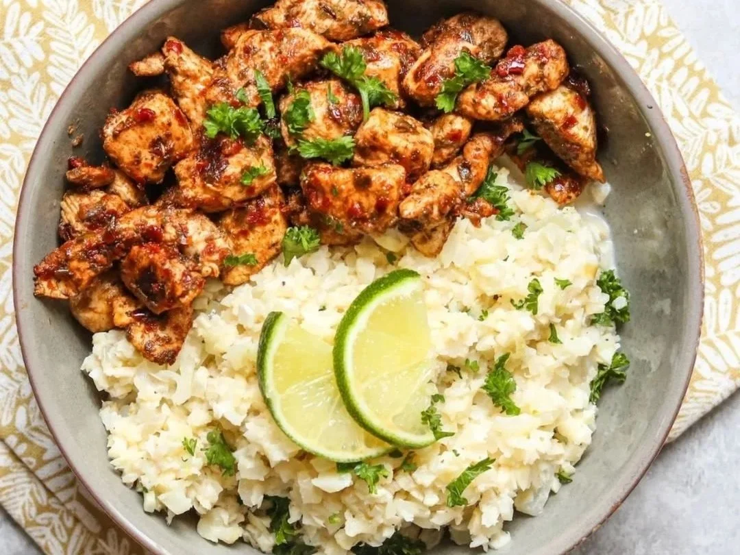 Spiced chicken with coconut cauliflower rice, coriander and lime