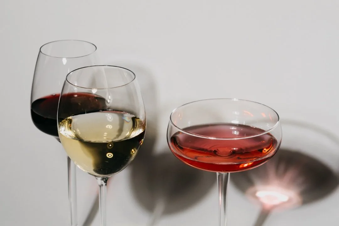 Three glasses of wine on a table