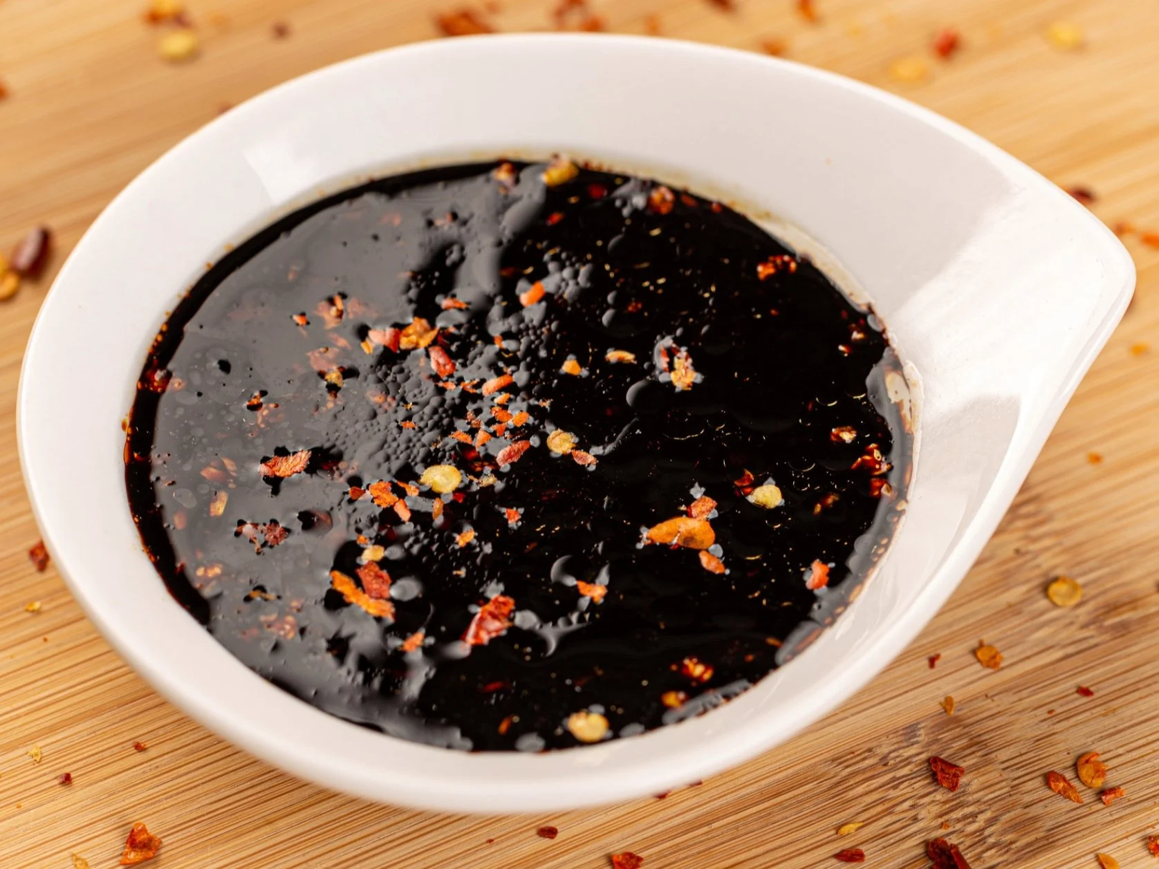 A bowl of sugar-free teriyaki glaze with fresh ginger and garlic