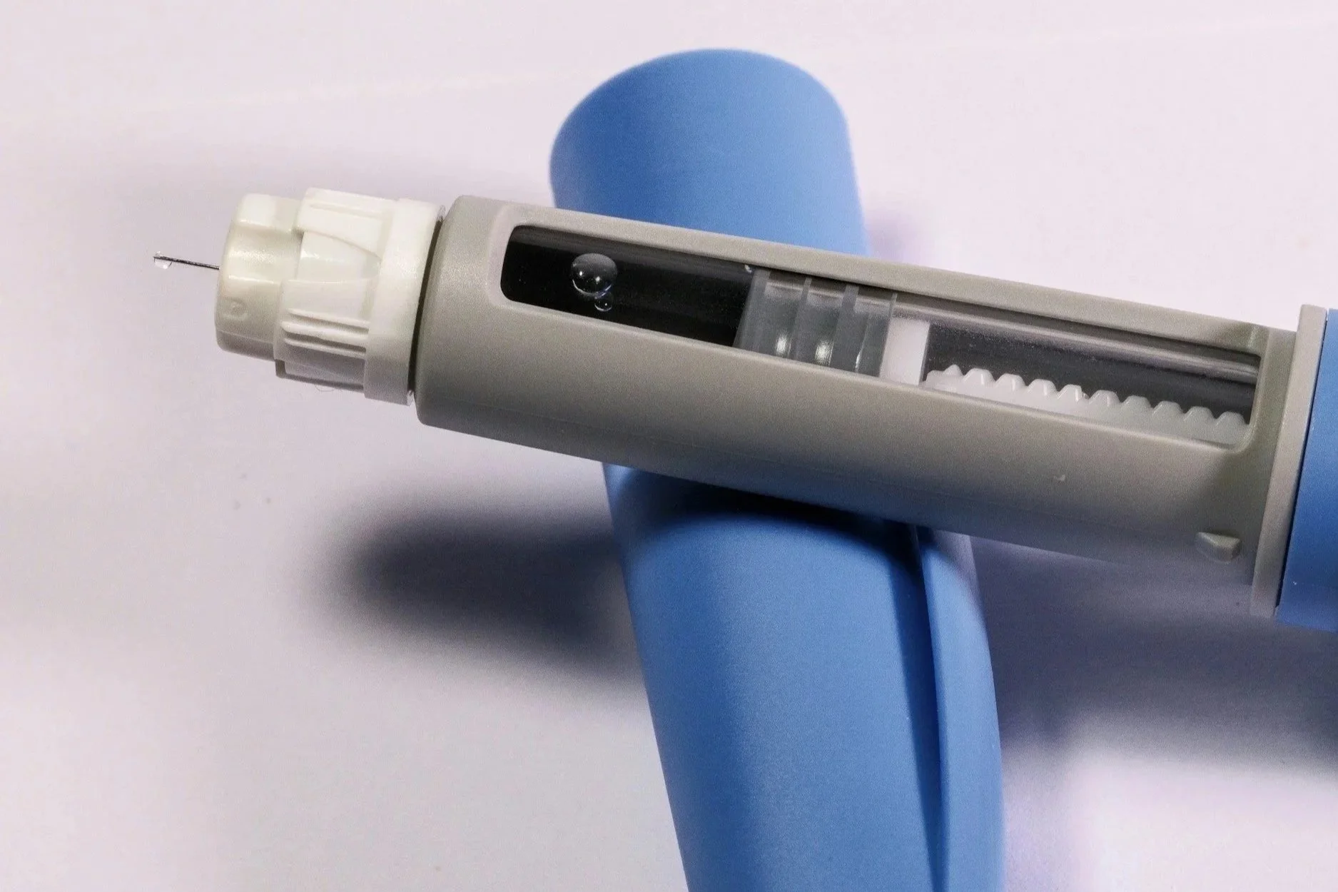 Ozempic injection pen on a light surface