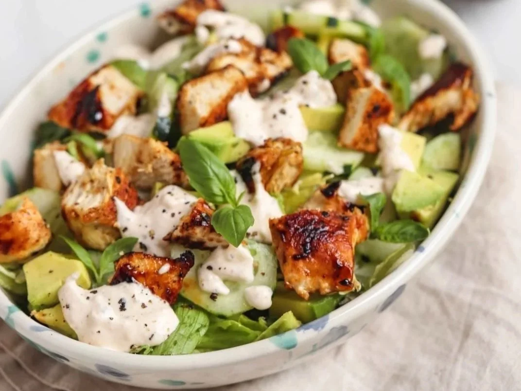 Butter lettuce salad with chicken, avocado, cucumber and walnuts
