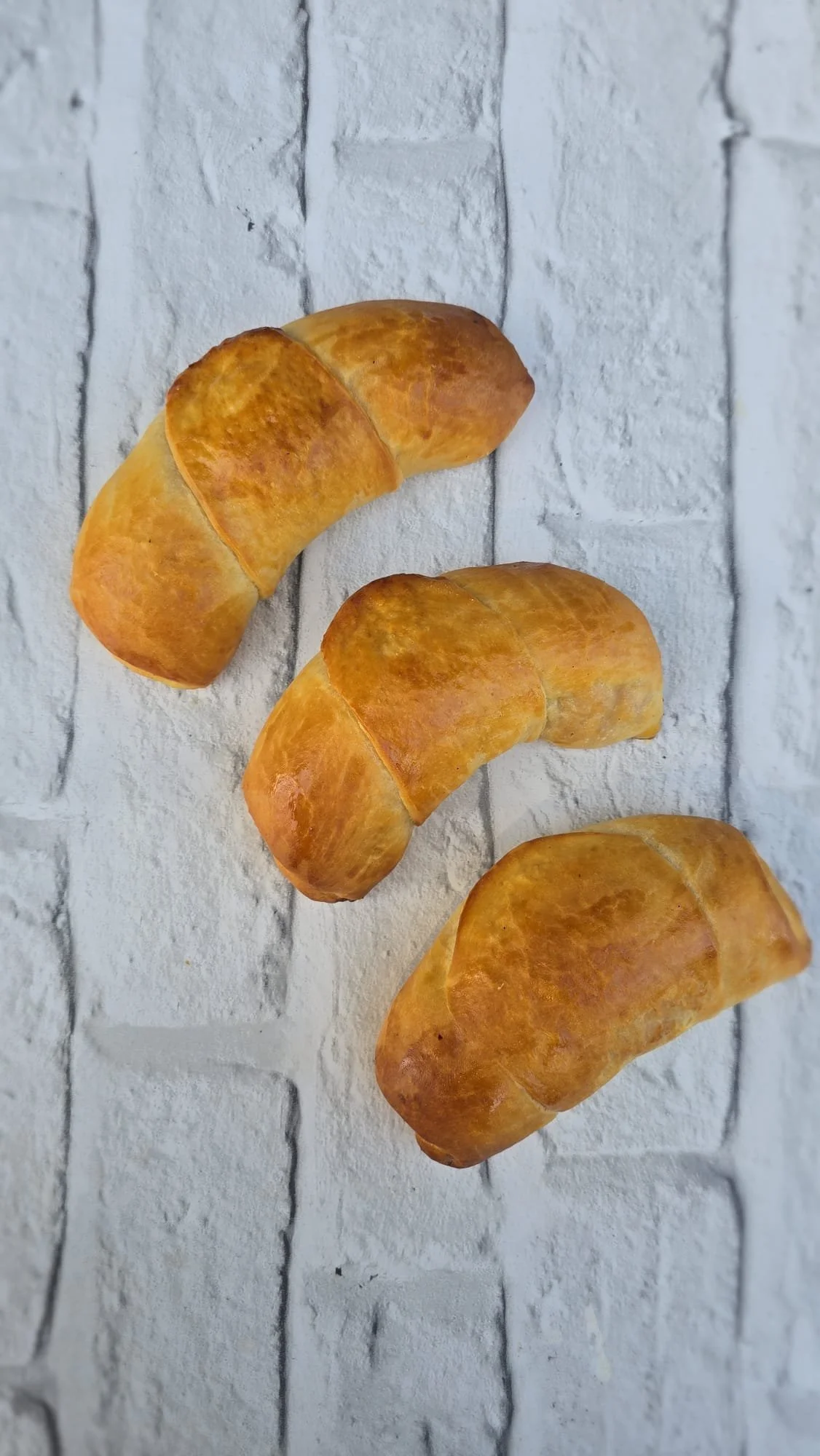 Venezuelan Traditional Cachitos. Soft crescent shaped bread filled with Ham and Bacon.