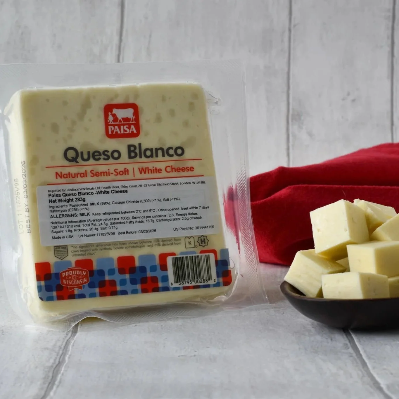 White Venezuelan cheese semi soft in Paisa packaging with cubes of cheese next to it