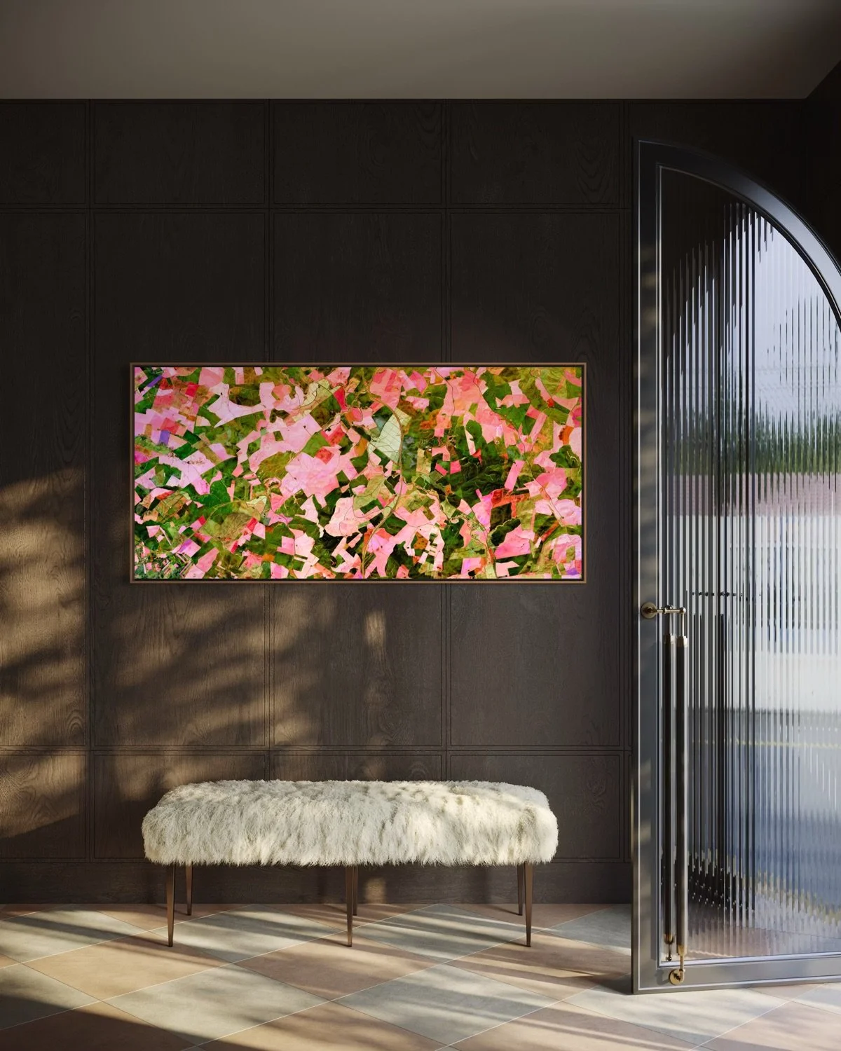 Modern interior with a dark wall, a framed abstract pink and green artwork, a white faux fur bench, and a glass door with vertical ridges.