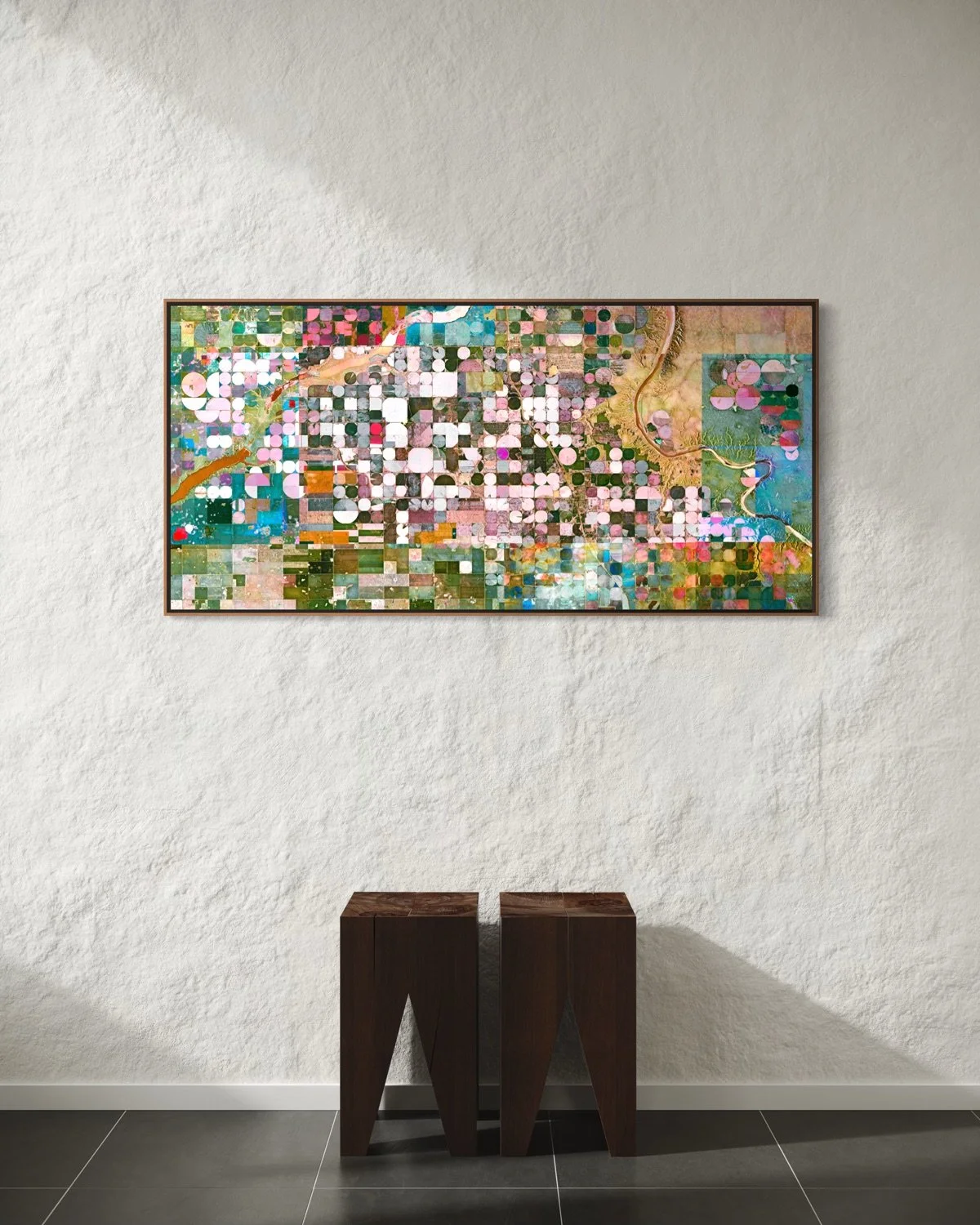 Ultradistancia Burdett by Federico Winer installed in a contemporary interior, showing a wide-format satellite artwork with circular irrigation patterns and pastel agricultural geometry from Alberta, Canada.