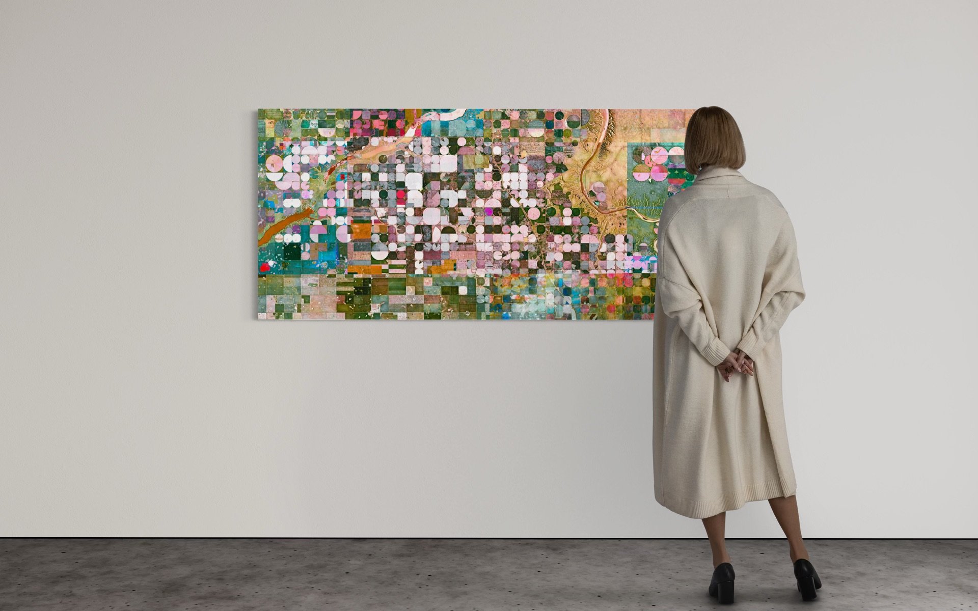 Ultradistancia Burdett by Federico Winer installed in a Museum interior, showing a wide-format satellite artwork with circular irrigation patterns and pastel agricultural geometry from Alberta, Canada.